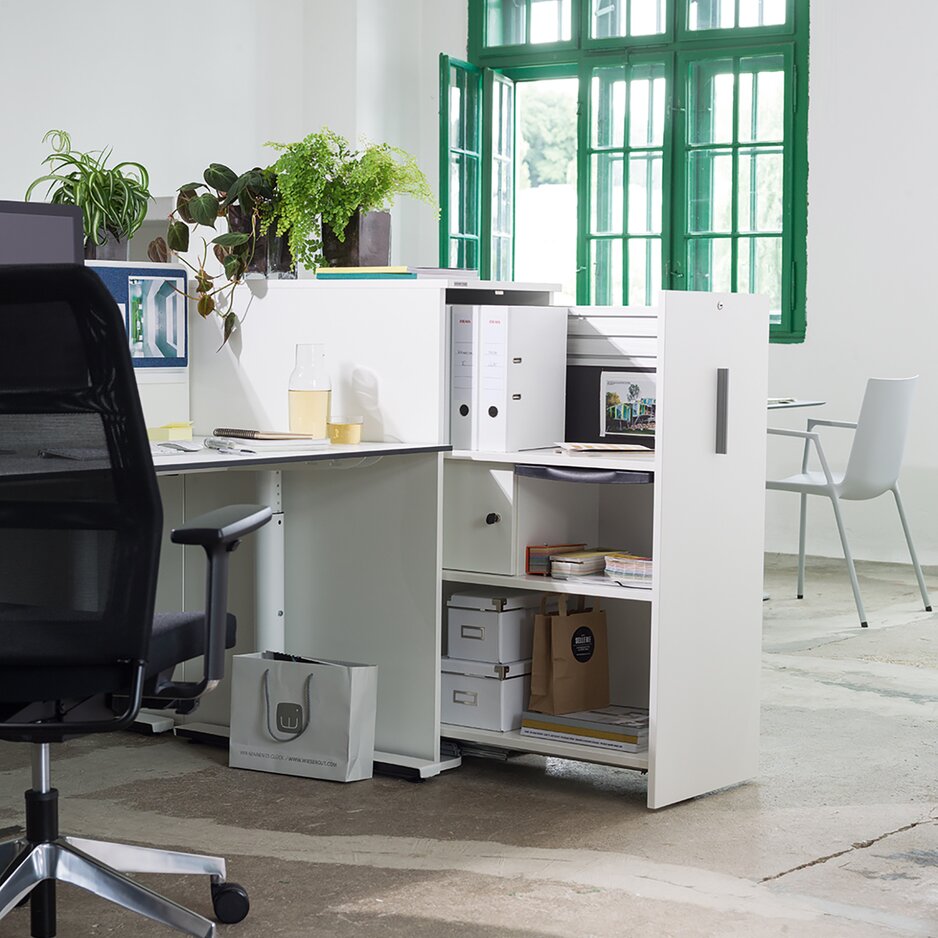 White pull-out cabinet at a workplace.