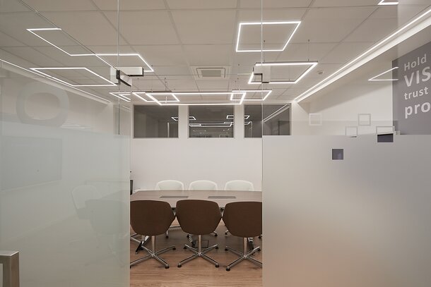 AHT Conference room with tables and chairs.