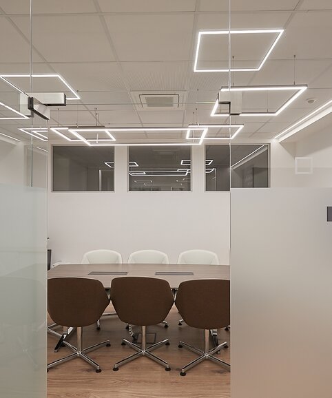 Conference room with tables and chairs.