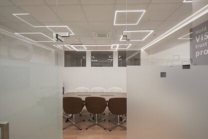 AHT Conference room with tables and chairs.