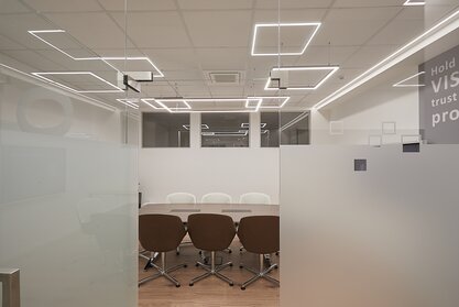 Conference room with tables and chairs.