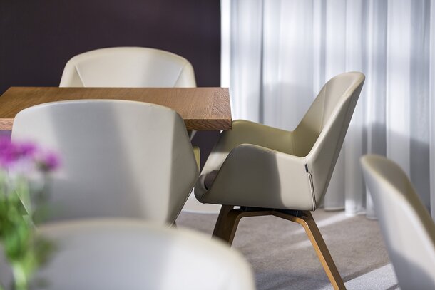 Gray lounge chair with a wooden table.