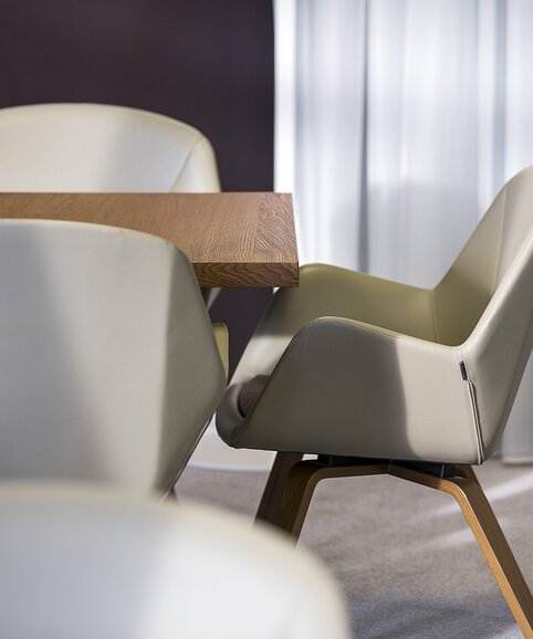 Gray lounge chair with a wooden table.