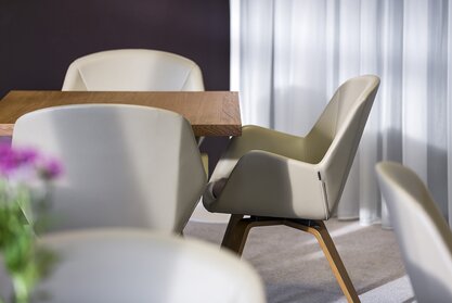 Gray lounge chair with a wooden table.