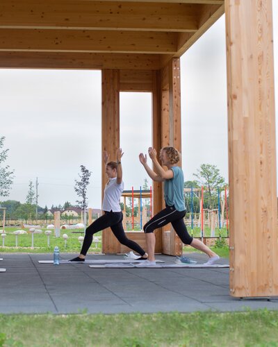 People do yoga in the Activity Garden.